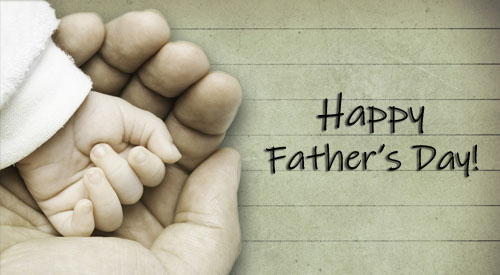 Image of childs hand in fathers hand